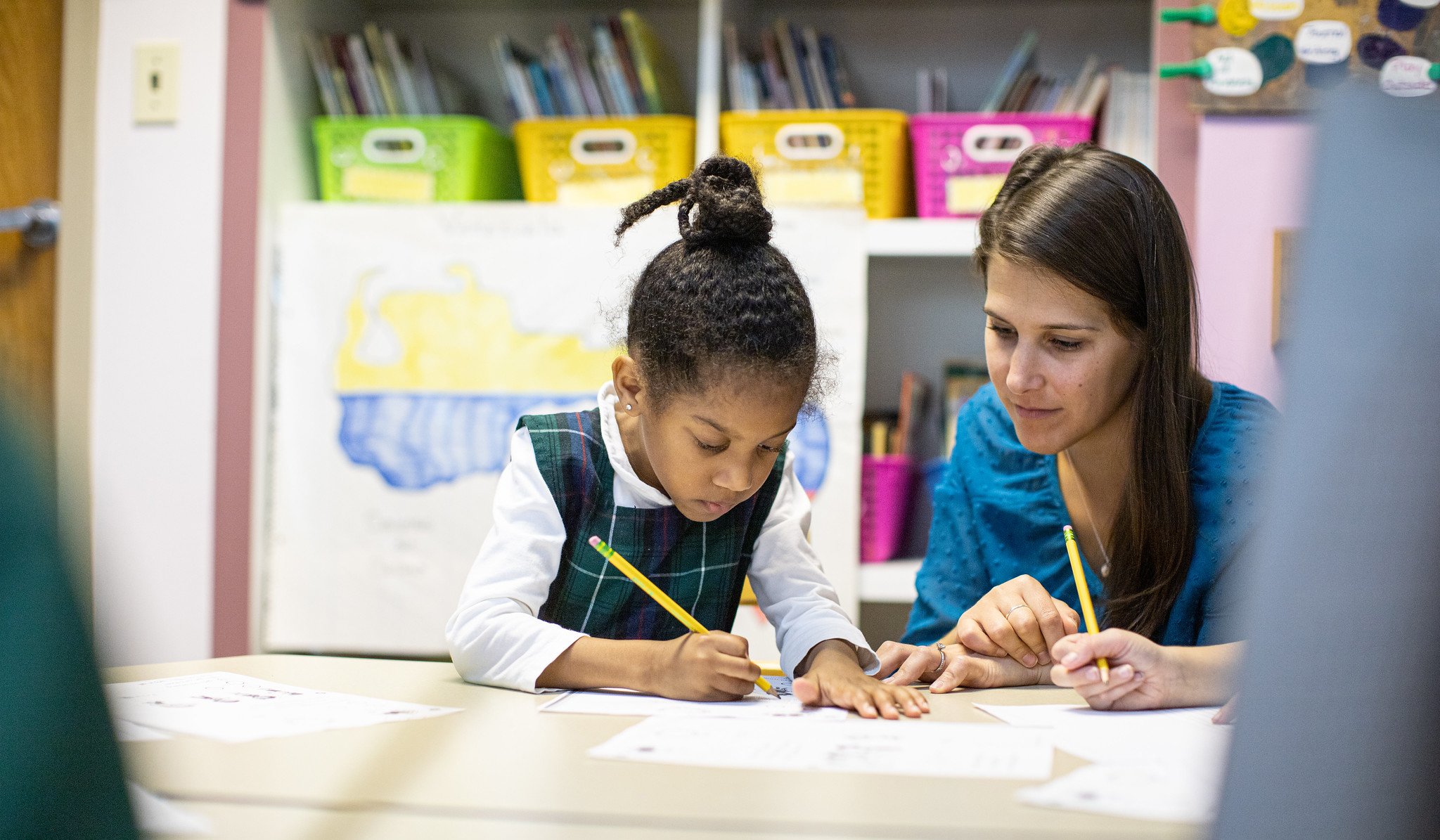 A teacher and student at The Ellis School, an all-girls private school in Pittsburgh, work together in a classroom.